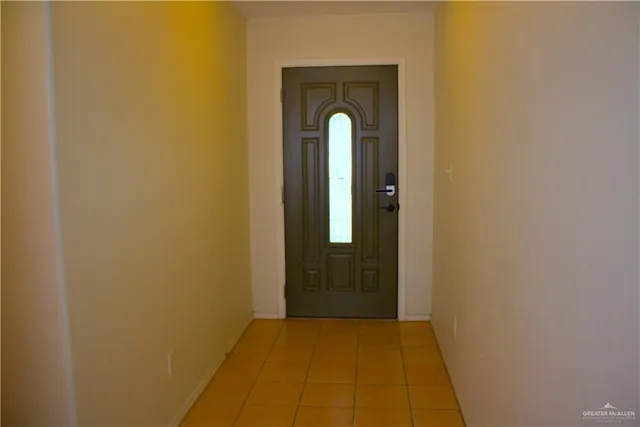 a view of a livingroom with wooden floor and a sink