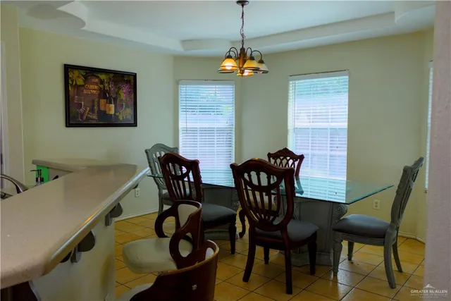a view of a dining room with furniture and window