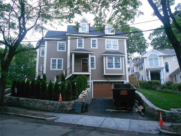 53 Helene Road, Unit 2 Newton, MA 02468 - Photo 1 of 3 a front view of a house with porch