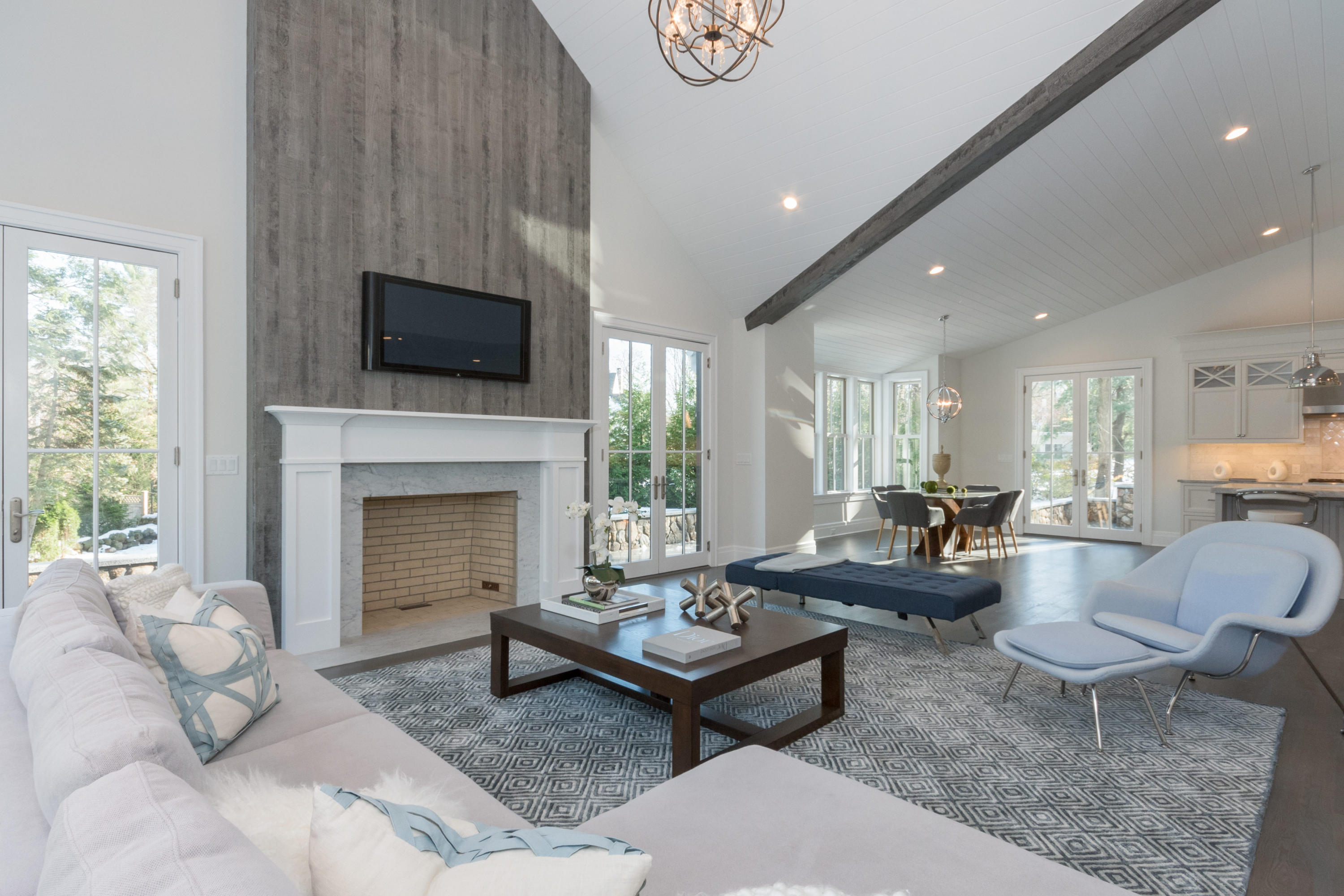 7 Revere Road Darien, CT 06820 - Photo 11 of 45 a living room with furniture a flat screen tv and a fireplace