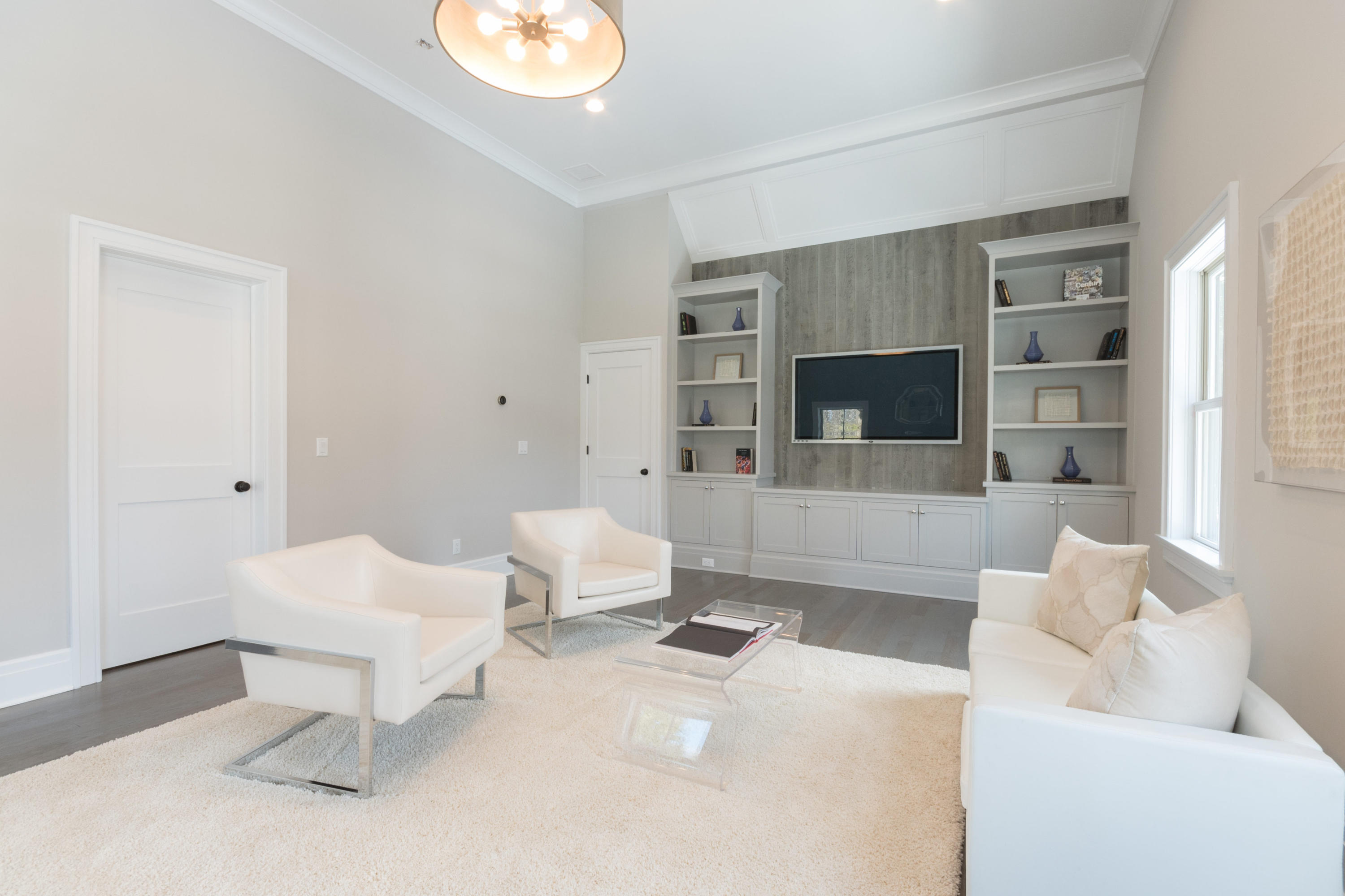 7 Revere Road Darien, CT 06820 - Photo 19 of 45 a living room with furniture and a fireplace