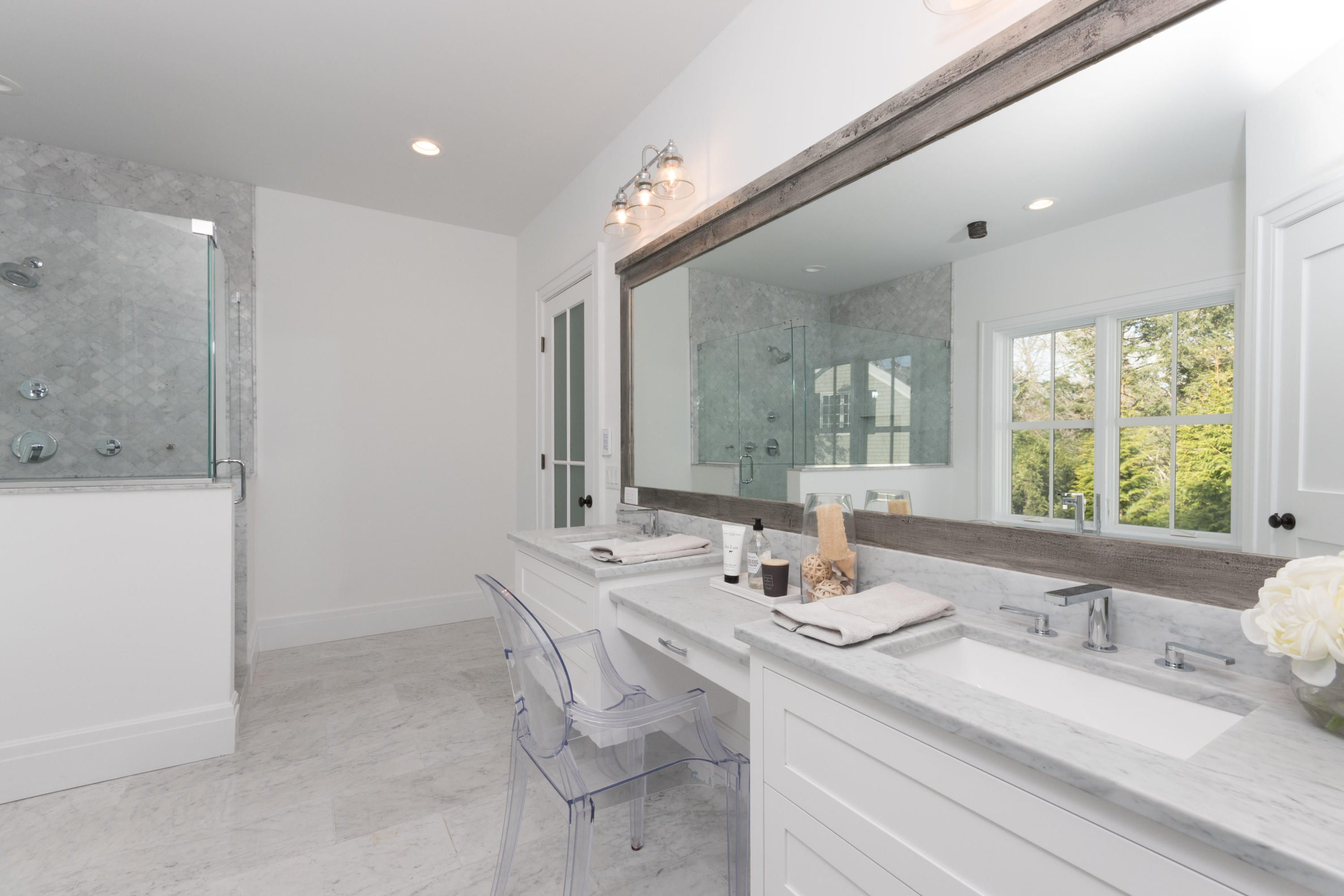 7 Revere Road Darien, CT 06820 - Photo 22 of 45 a bathroom with a double vanity sink and a mirror