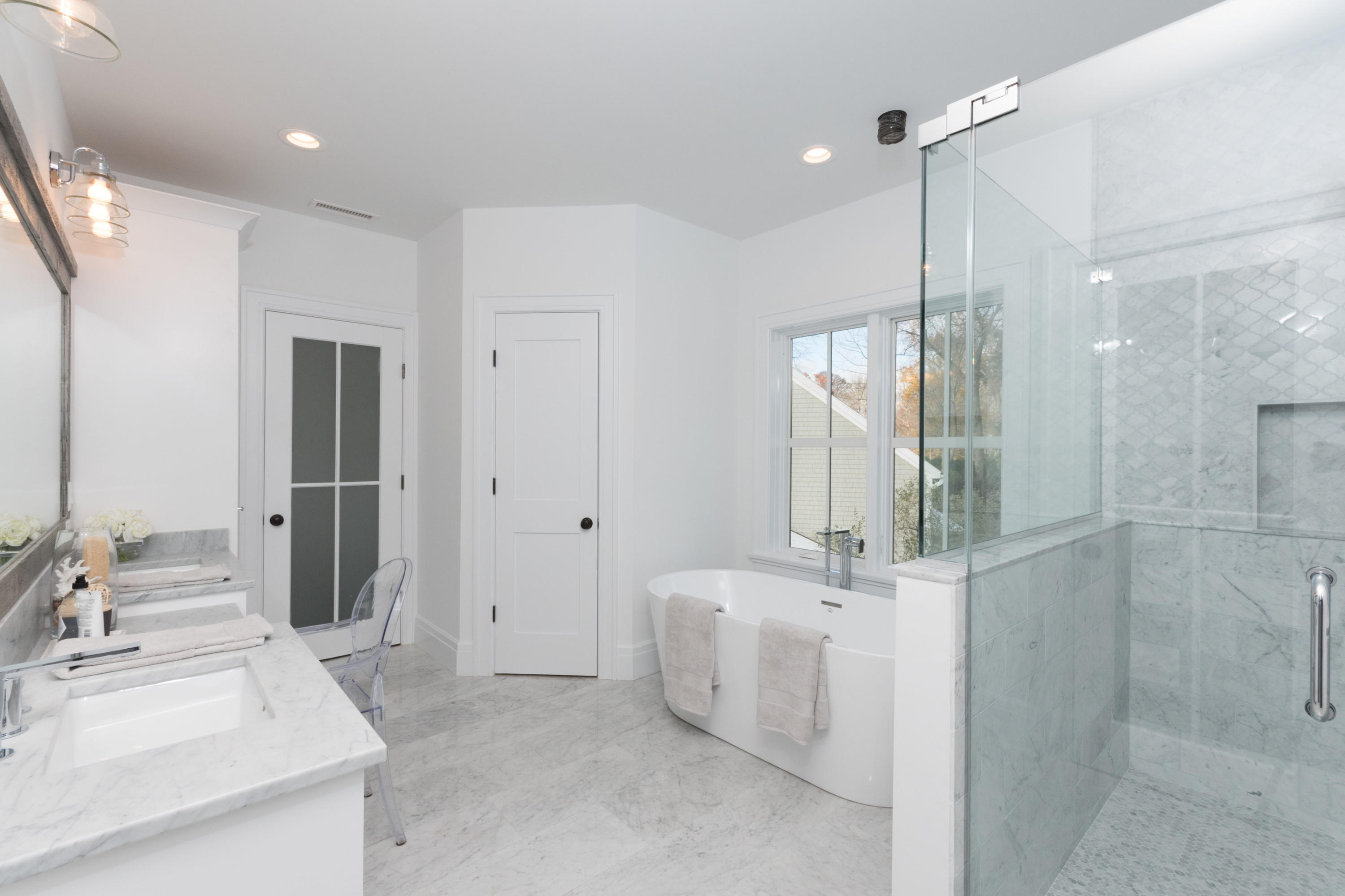 7 Revere Road Darien, CT 06820 - Photo 23 of 45 a bathroom with a sink mirror and a shower