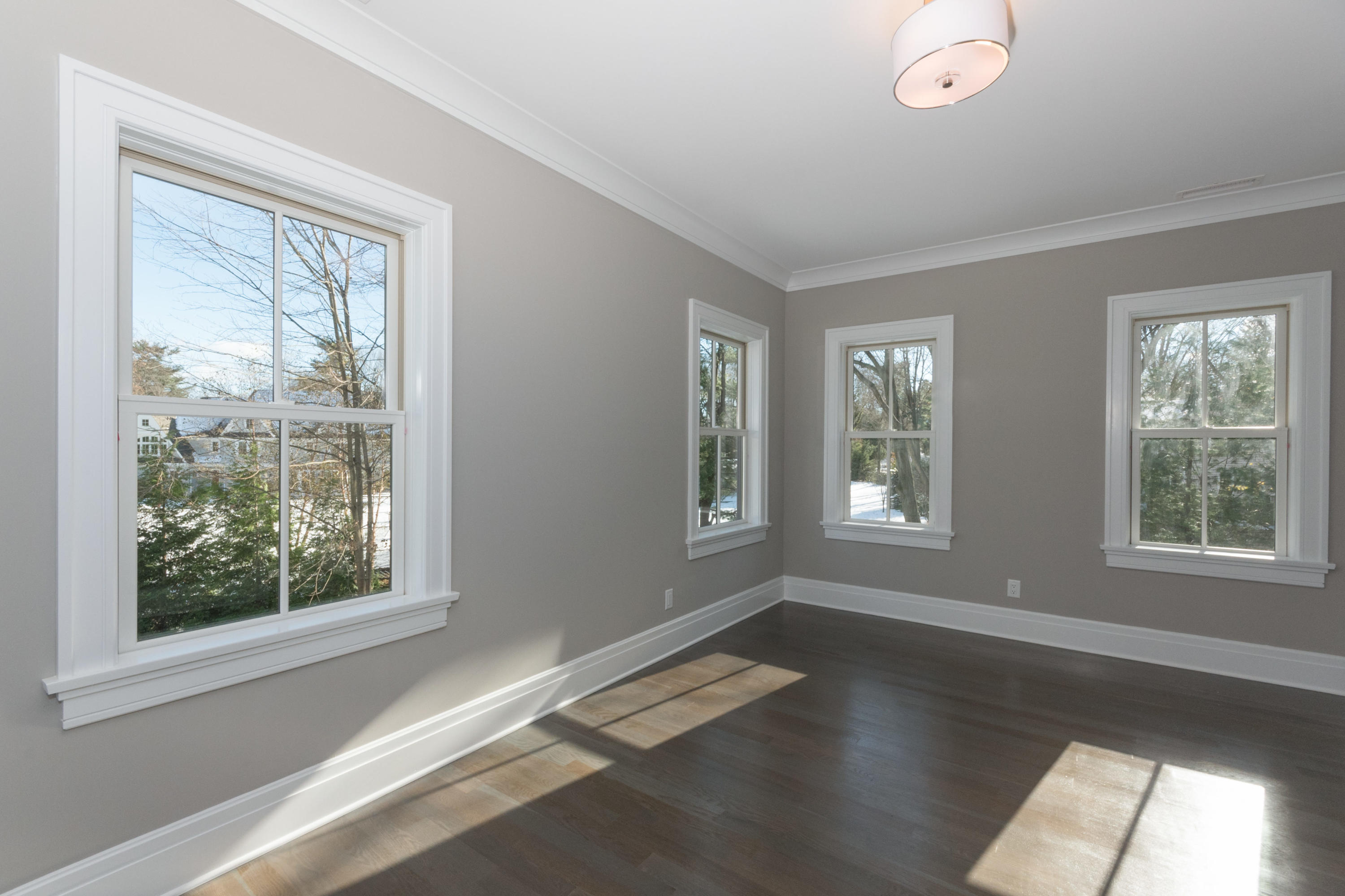 7 Revere Road Darien, CT 06820 - Photo 24 of 45 a view of an empty room with wooden floor and a window