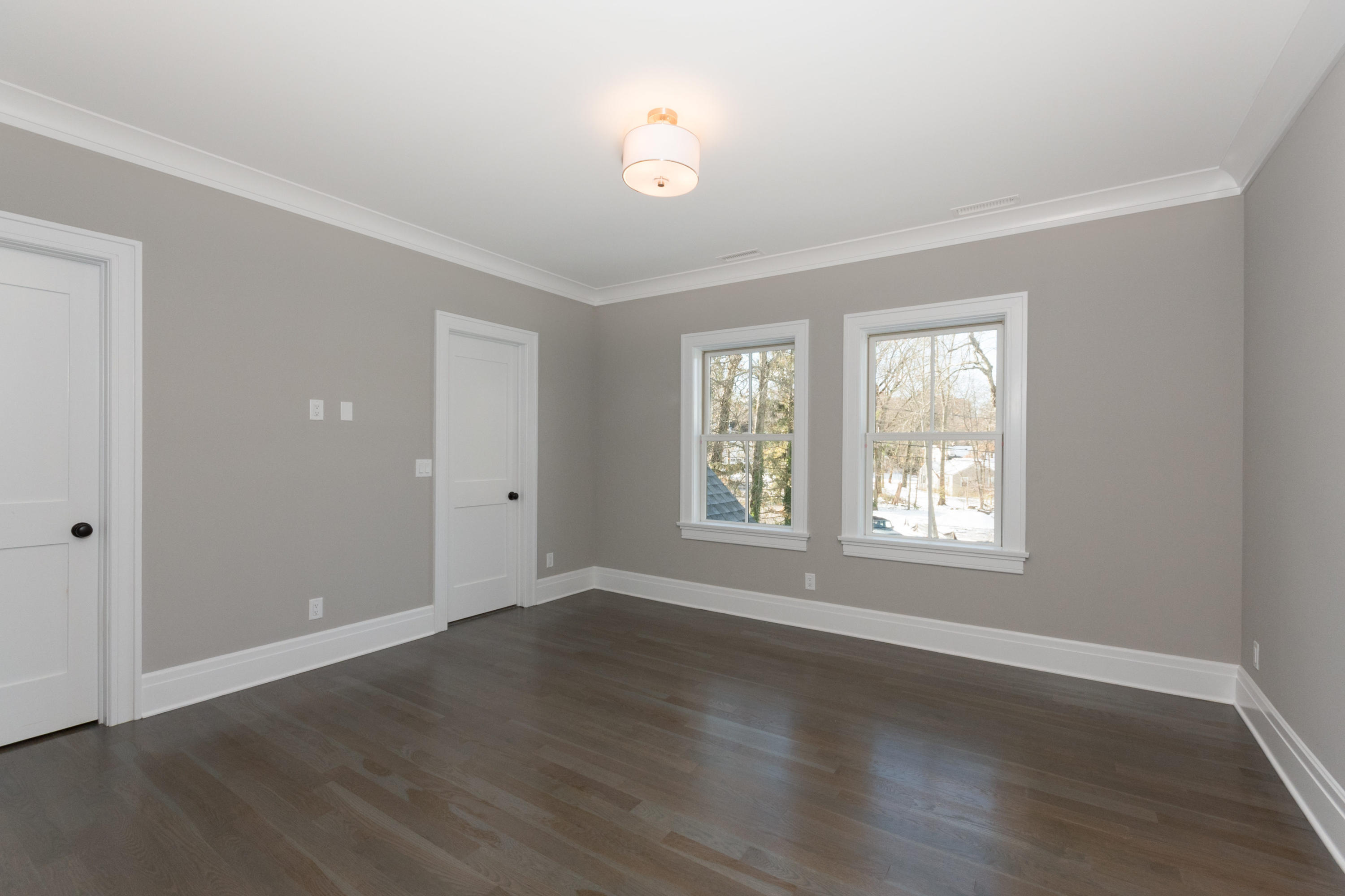 7 Revere Road Darien, CT 06820 - Photo 26 of 45 a view of an empty room with wooden floor and a window