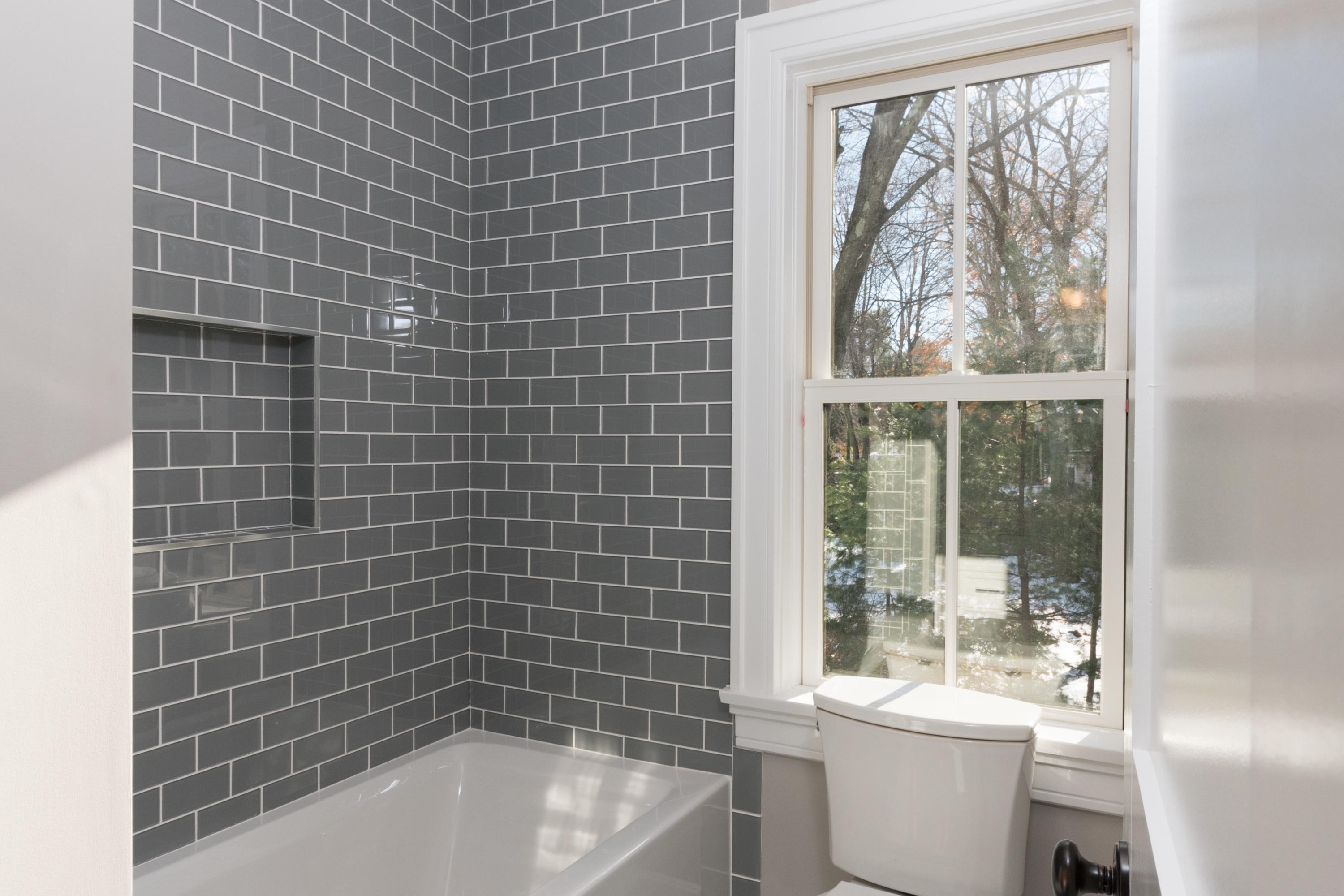 7 Revere Road Darien, CT 06820 - Photo 28 of 45 a bathroom with a bathtub a toilet a sink and a shower