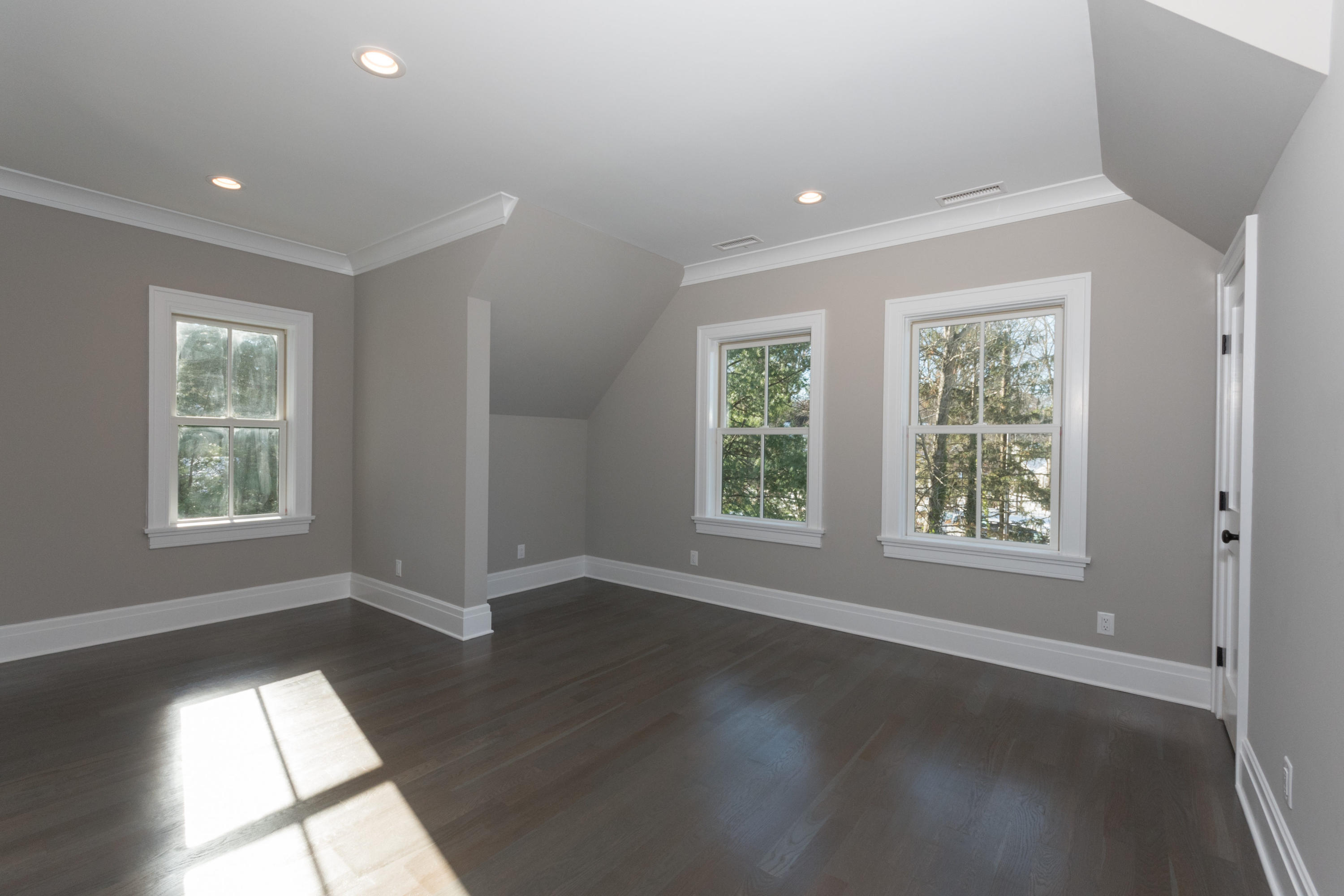 7 Revere Road Darien, CT 06820 - Photo 29 of 45 an empty room with wooden floor and windows