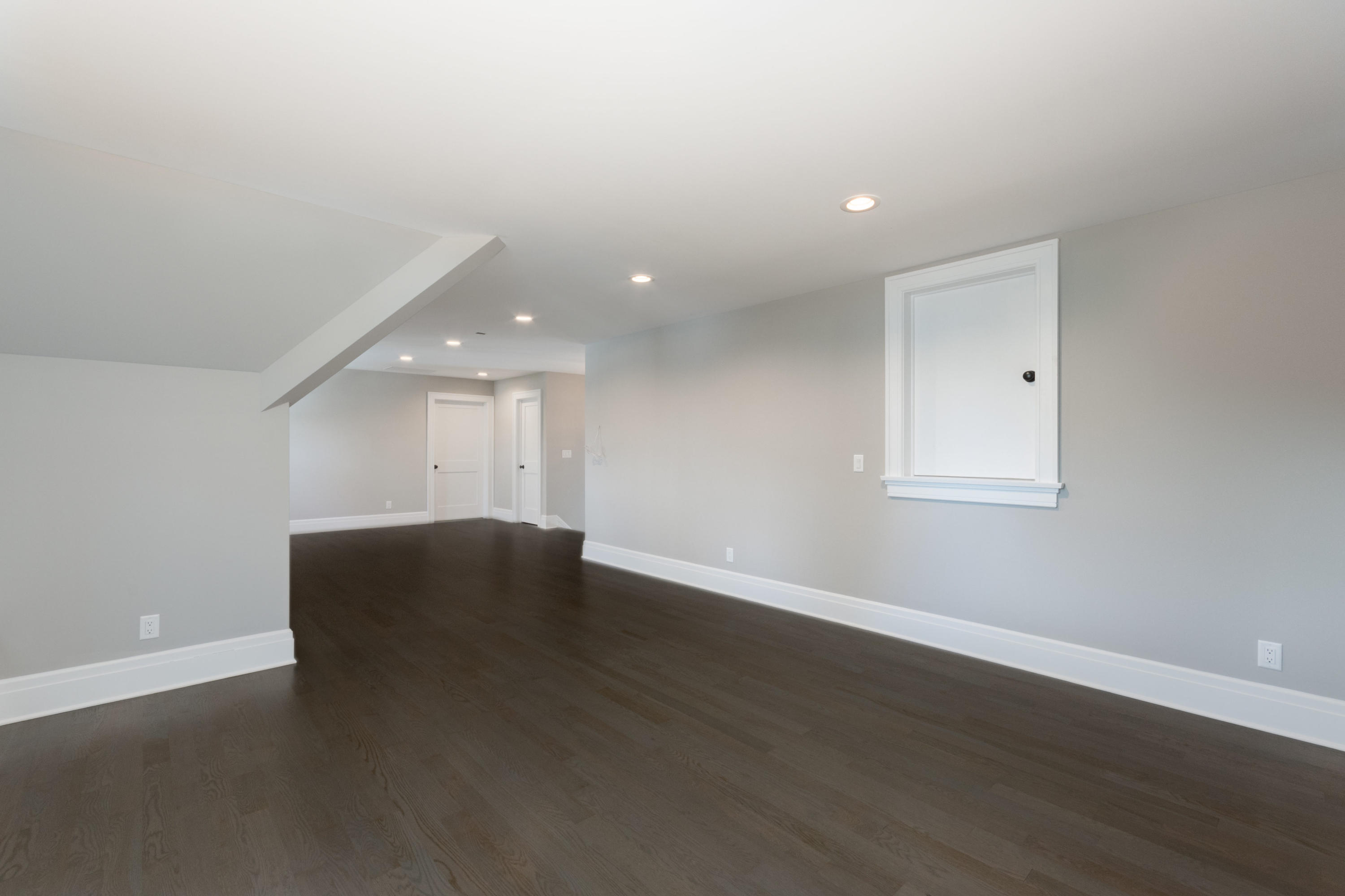 7 Revere Road Darien, CT 06820 - Photo 35 of 45 a view of an empty room with wooden floor