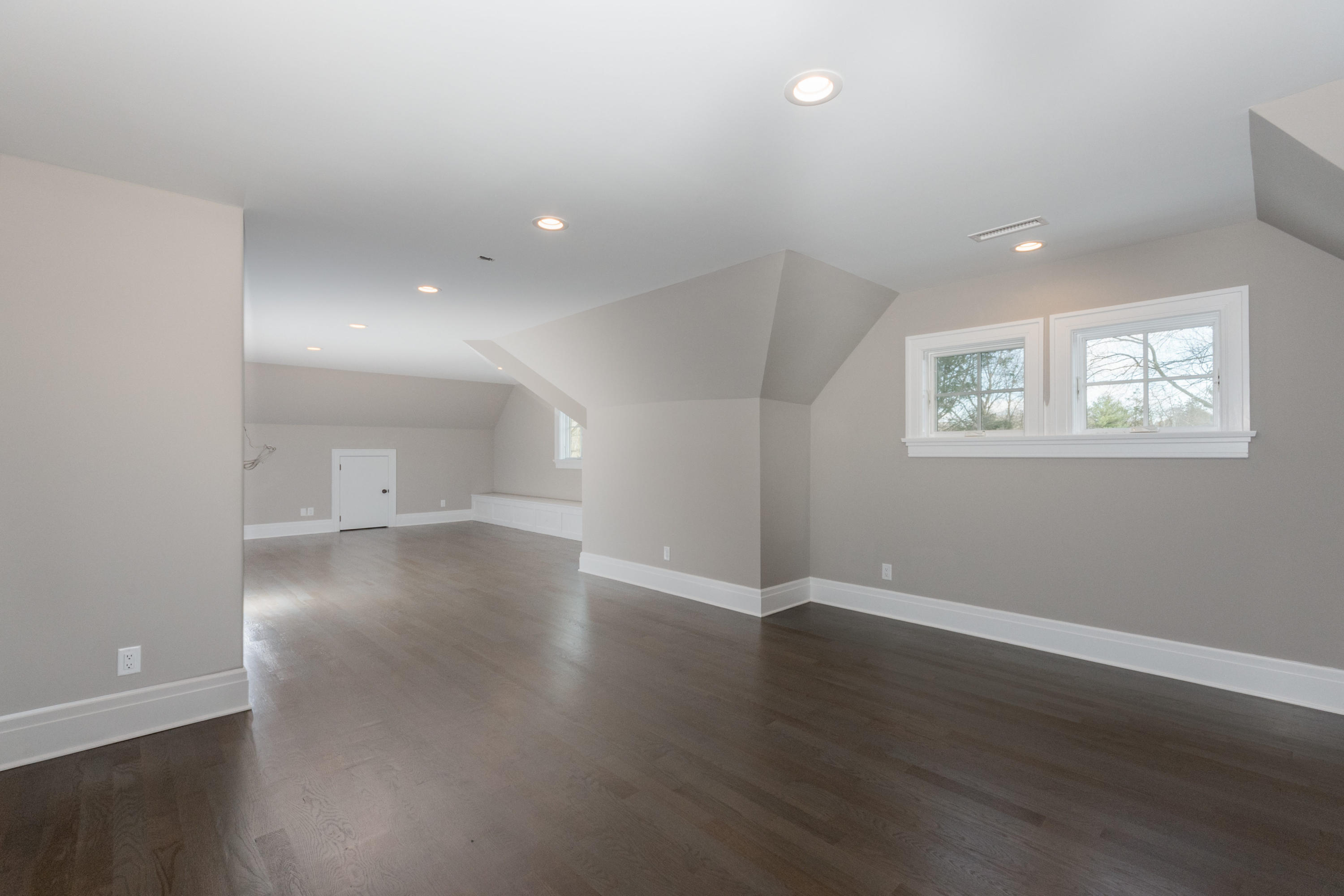 7 Revere Road Darien, CT 06820 - Photo 36 of 45 an empty room with wooden floor and windows