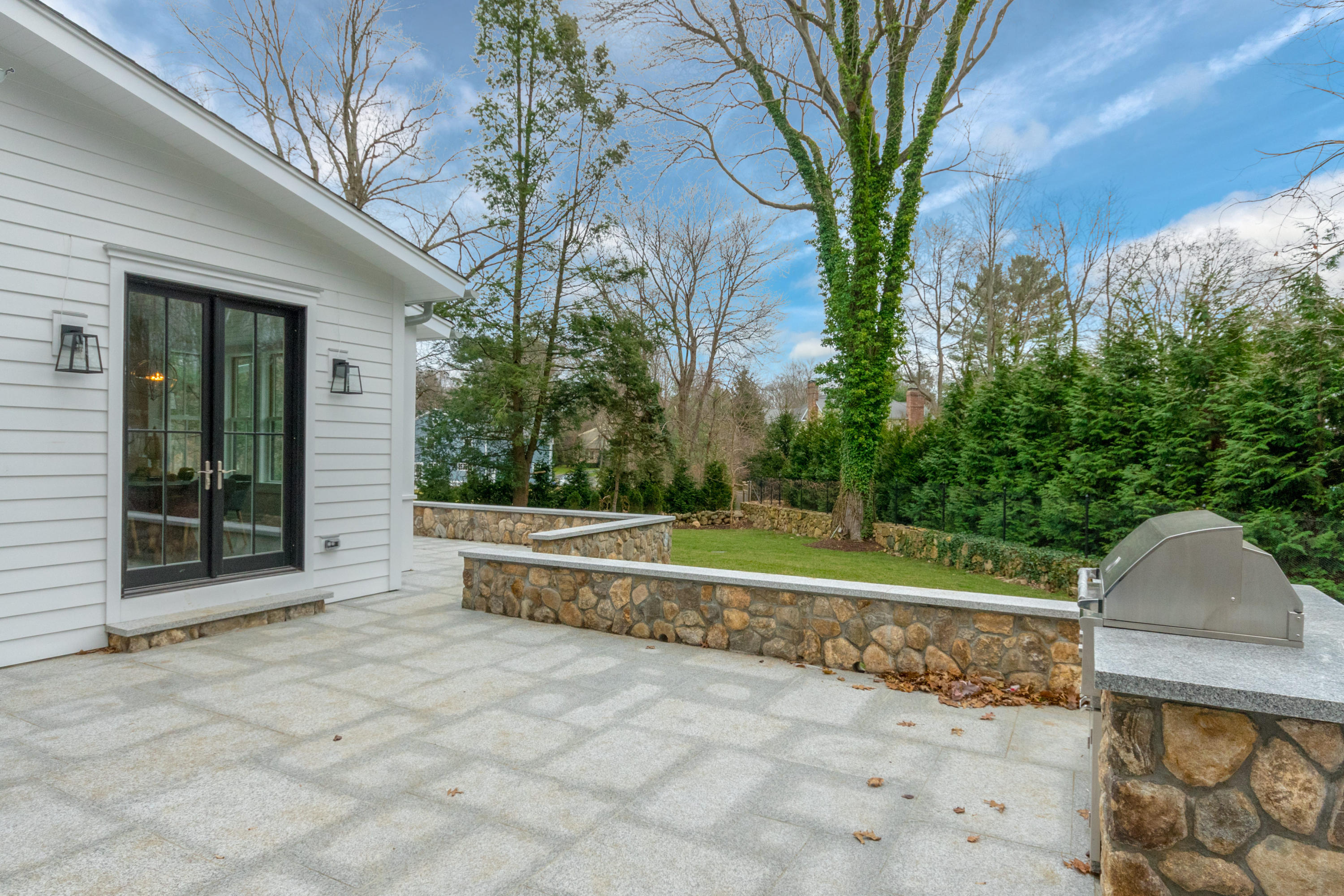 7 Revere Road Darien, CT 06820 - Photo 40 of 45 a view of a back yard of the house