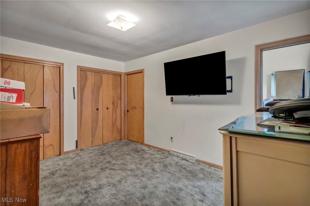 3524 Oak Road Stow, OH 44224 - Photo 9 of 19 Carpeted bedroom featuring baseboards and two closets