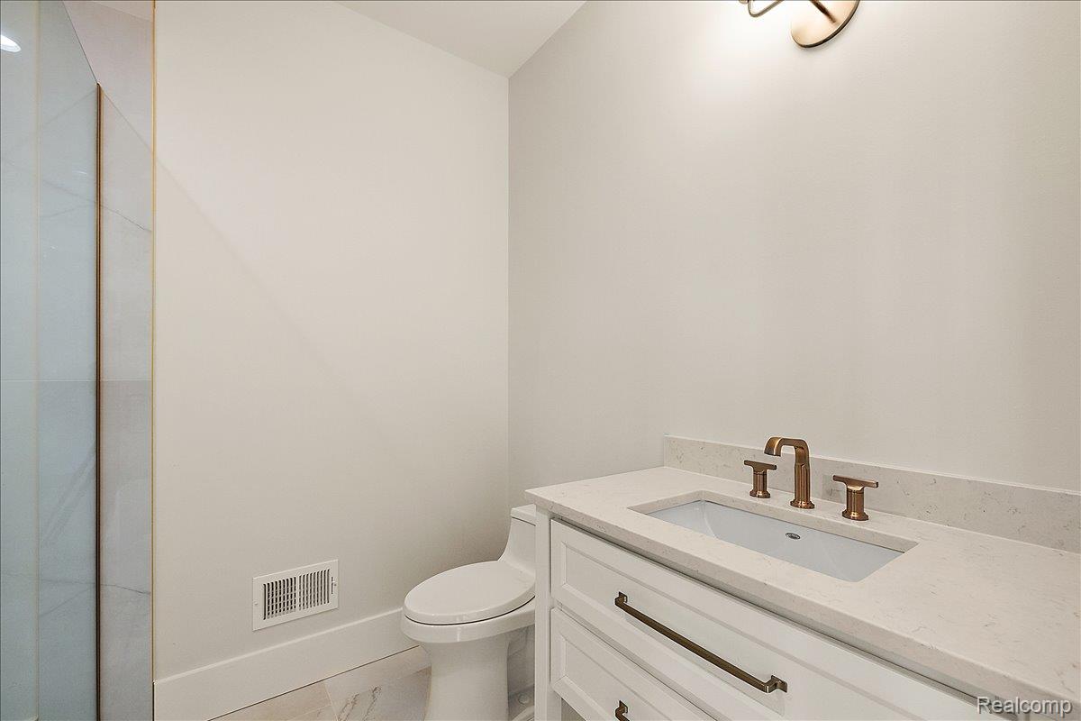 13459 Haddon Street Fenton, MI 48430 - Photo 47 of 84 Full bathroom featuring vanity and toilet