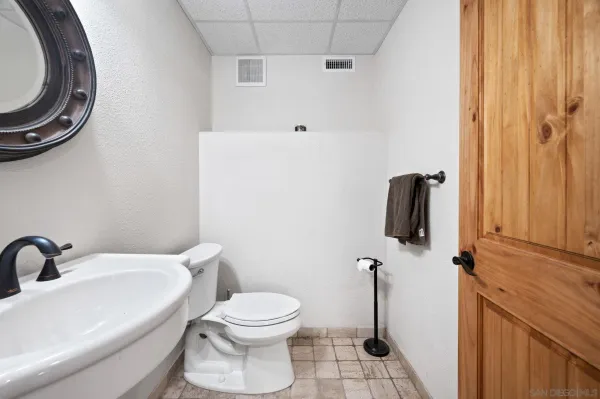 a bathroom with a toilet and a sink