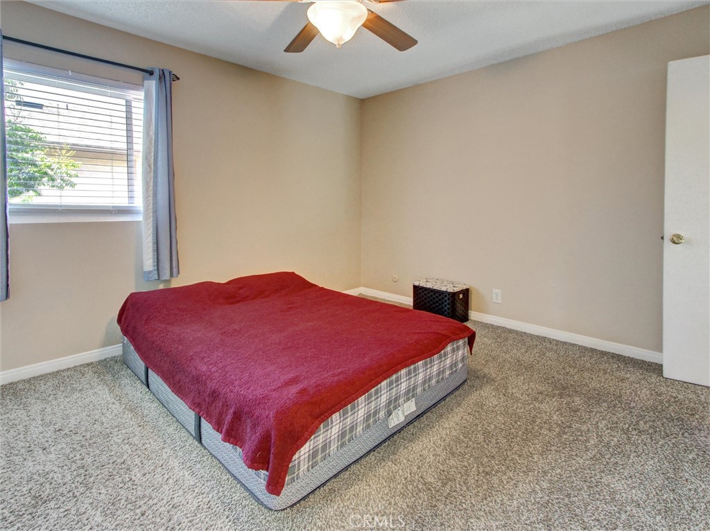 1881 Mitchell Avenue, Unit 63 Tustin, CA 92780 - Photo 13 of 24 a bed sitting in a room next to a window