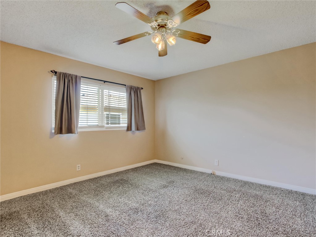 1881 Mitchell Avenue, Unit 63 Tustin, CA 92780 - Photo 18 of 24 a view of an empty room with a window