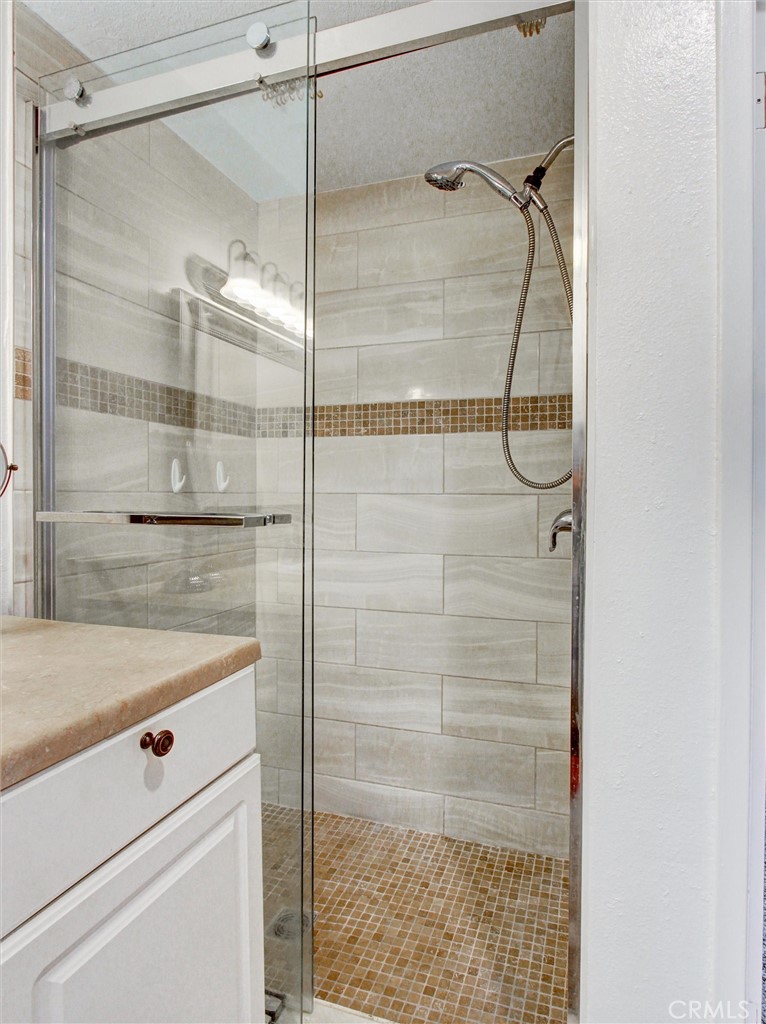 1881 Mitchell Avenue, Unit 63 Tustin, CA 92780 - Photo 21 of 24 a bathroom with a shower and a shower
