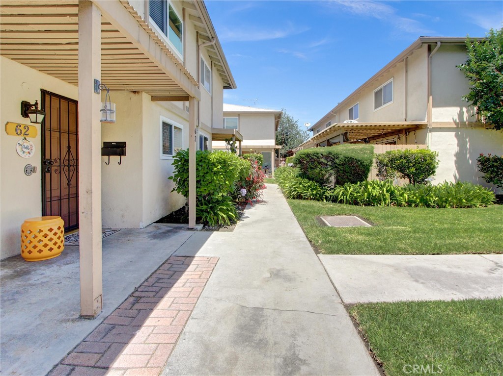 1881 Mitchell Avenue, Unit 63 Tustin, CA 92780 - Photo 3 of 24 a view of a pathway with a house