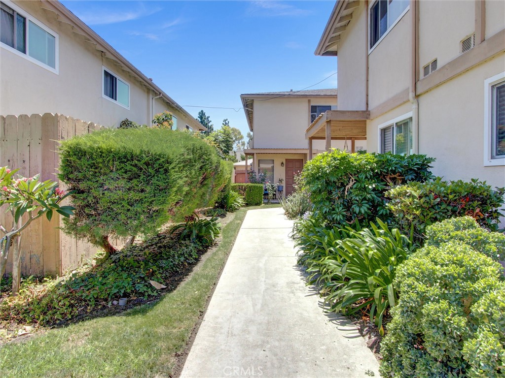 1881 Mitchell Avenue, Unit 63 Tustin, CA 92780 - Photo 4 of 24 a house view with a garden space