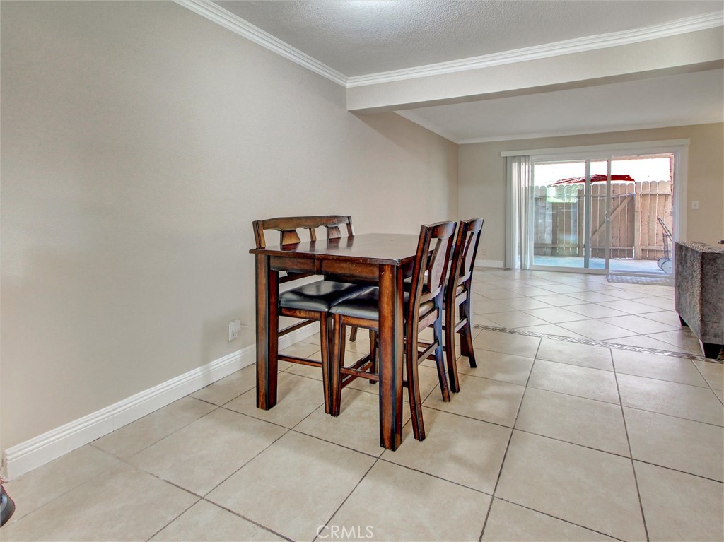 1881 Mitchell Avenue, Unit 63 Tustin, CA 92780 - Photo 7 of 24 a dining room with furniture and window