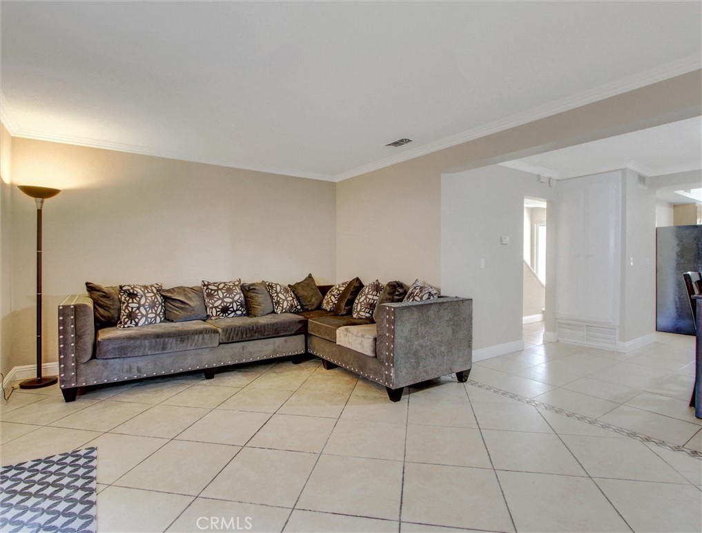 1881 Mitchell Avenue, Unit 63 Tustin, CA 92780 - Photo 9 of 24 a living room with furniture and a table