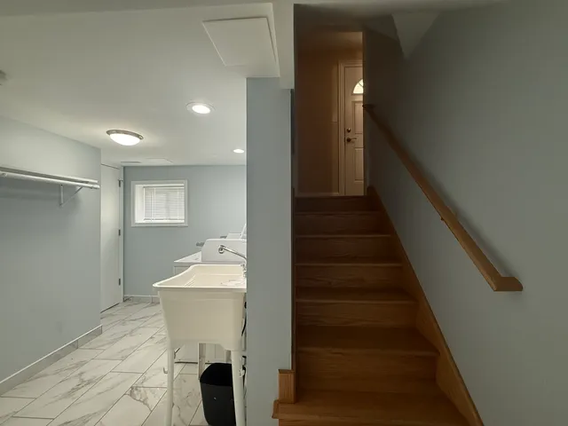 a room with stairs and furniture