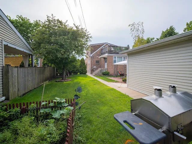 a view of a backyard with a garden