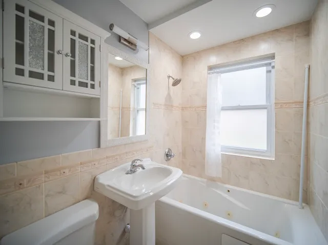 a bathroom with a sink and a bathtub