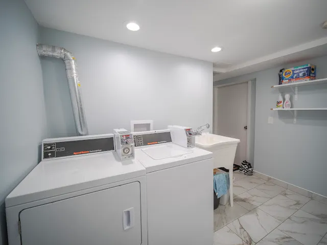 a utility room with dryer and washer