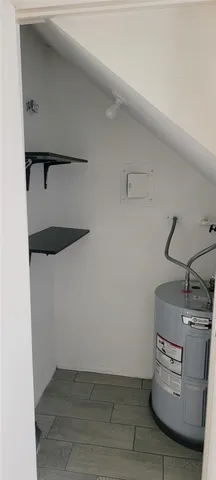 a view of storage and utility room with washer and dryer