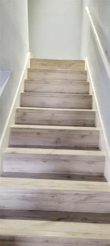 a view of staircase with white walls