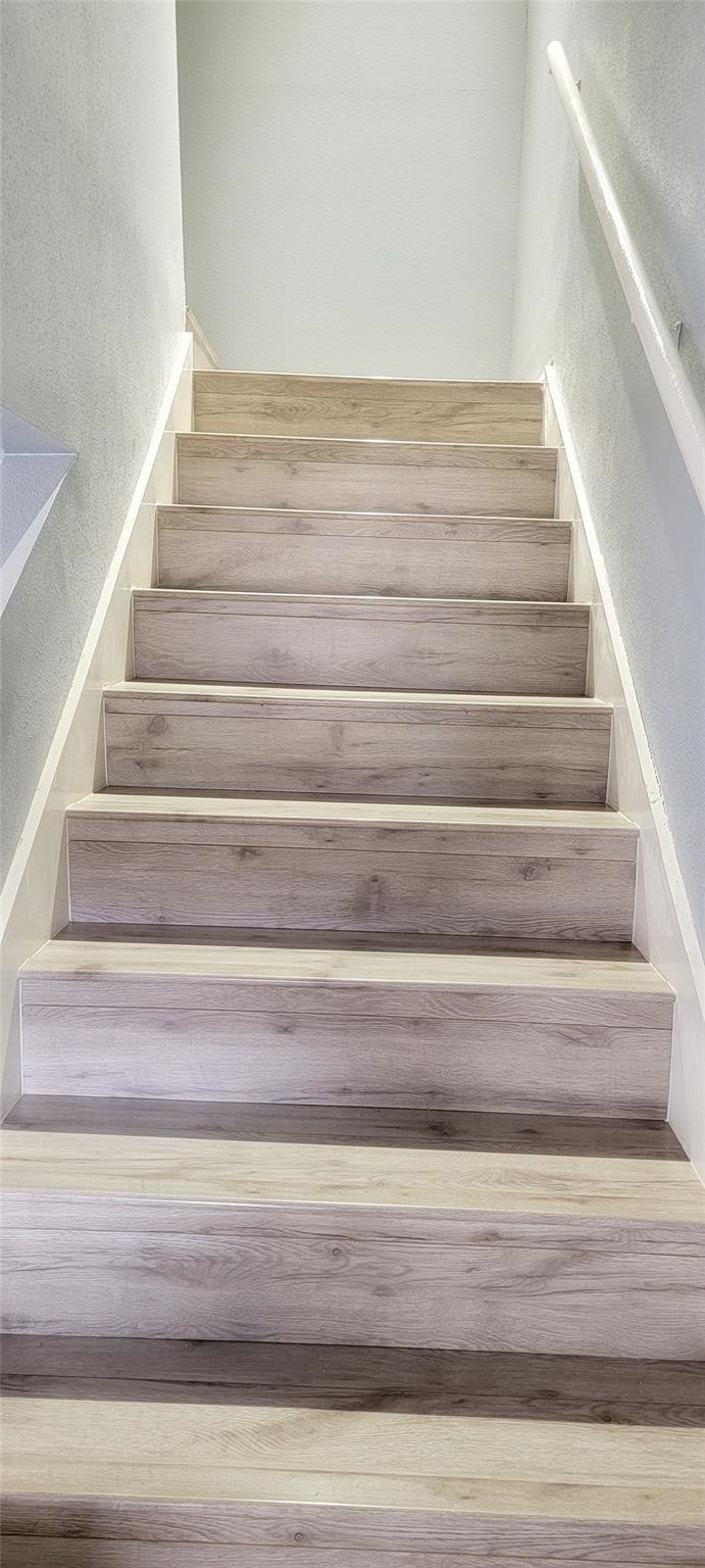 2110 Wilcrest Drive, Unit 113 Houston, TX 77077 - Photo 9 of 22 a view of staircase with white walls