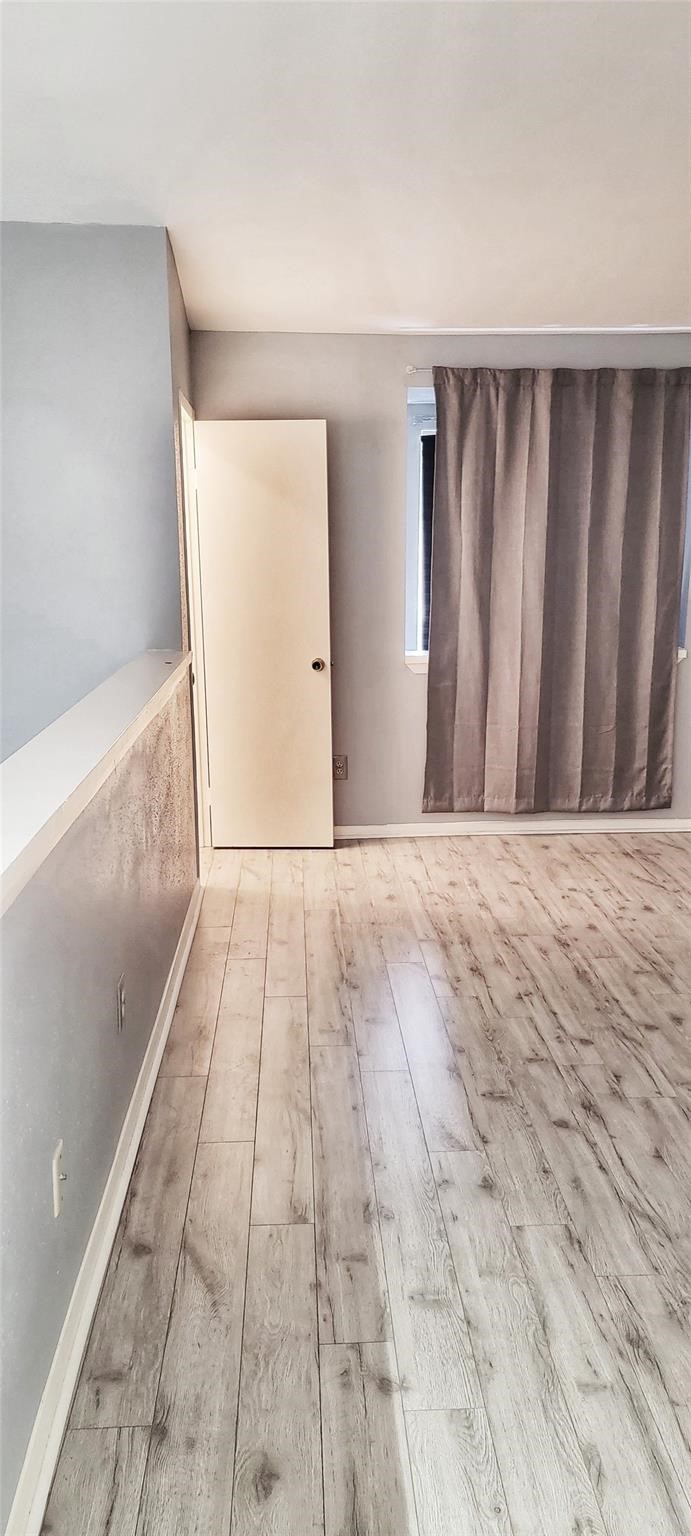 2110 Wilcrest Drive, Unit 113 Houston, TX 77077 - Photo 10 of 22 a view of wooden floor