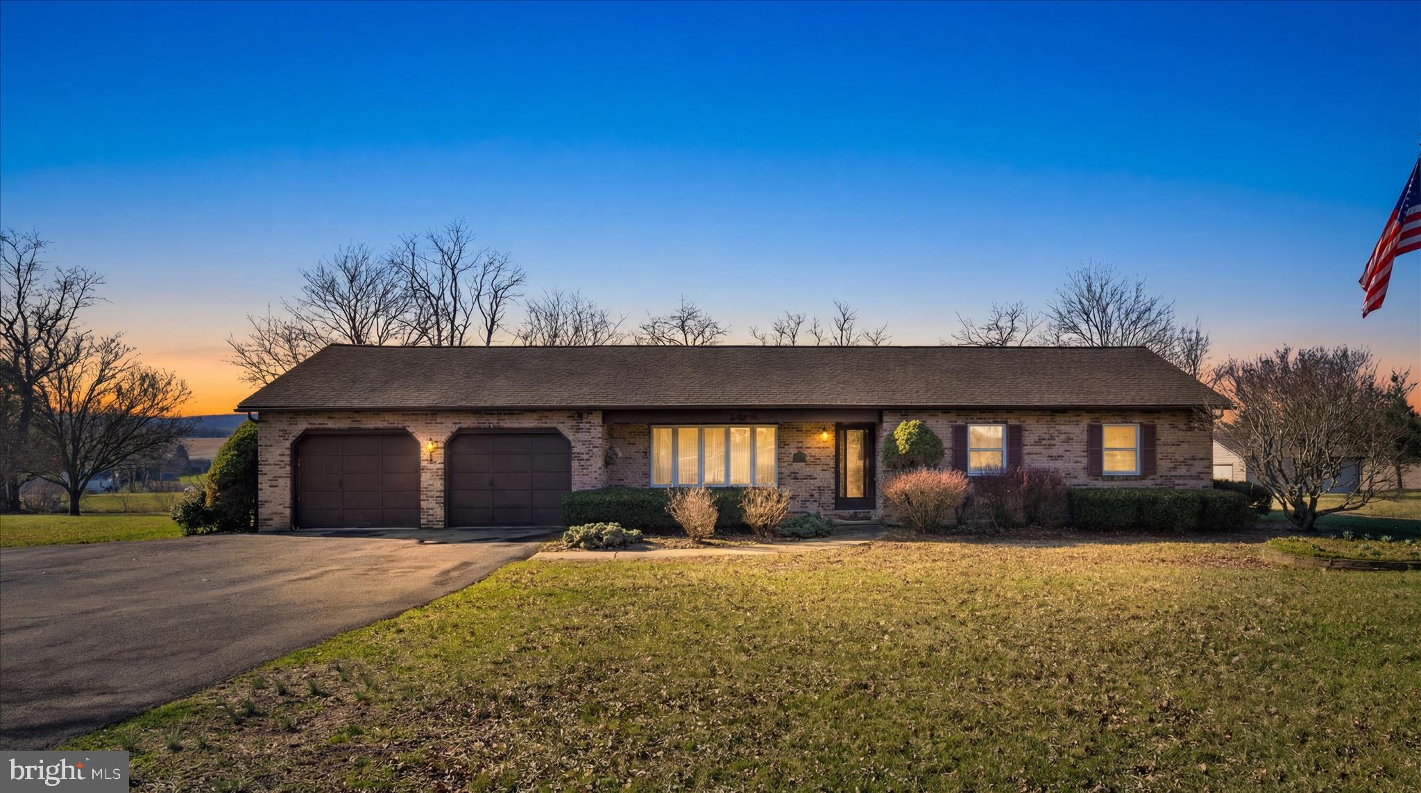 649 Stone Hill Road Shoemakersville, PA 19555 - Photo 11 of 43 a front view of house with yard and trees in the background