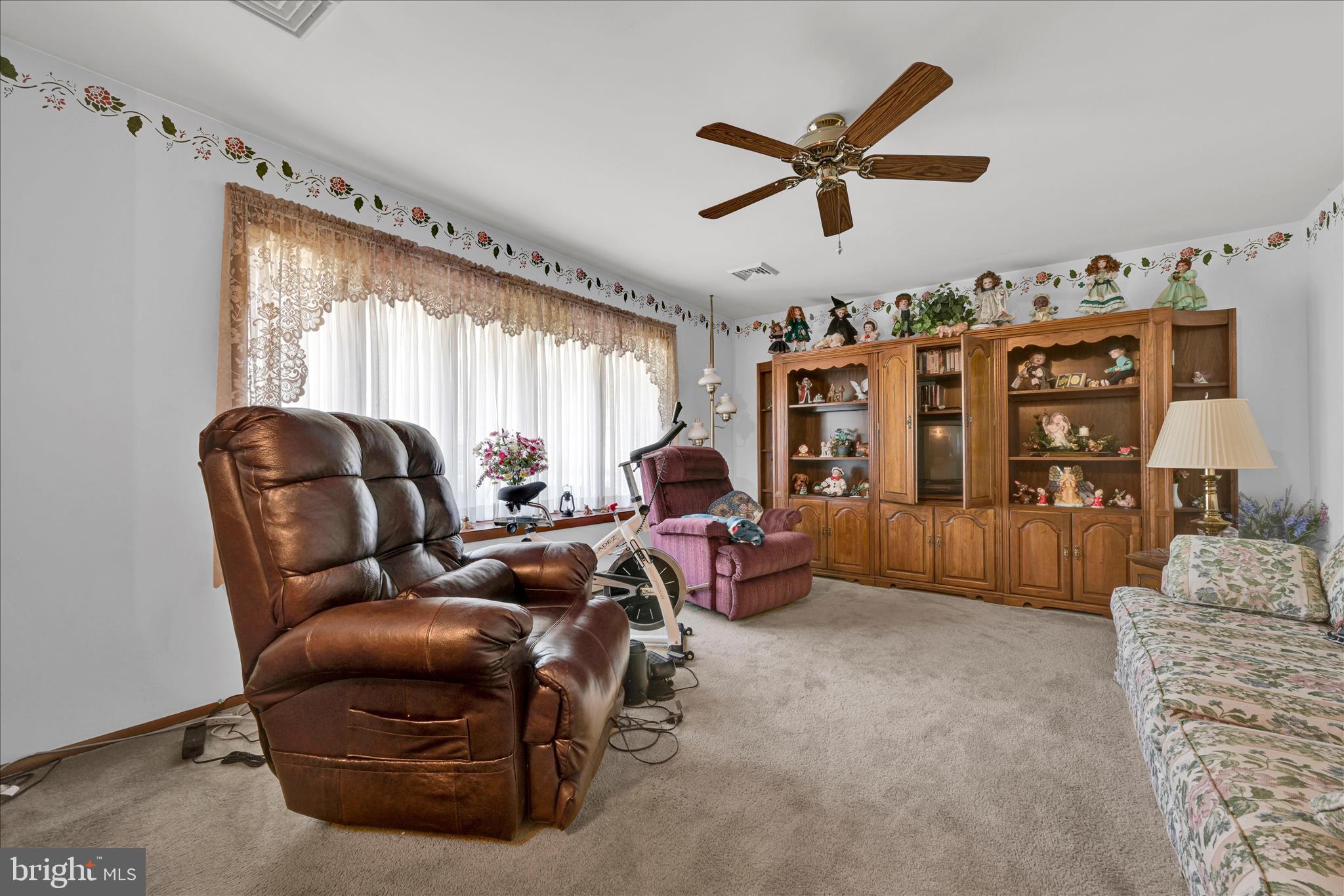 649 Stone Hill Road Shoemakersville, PA 19555 - Photo 15 of 43 a living room with furniture and a large window