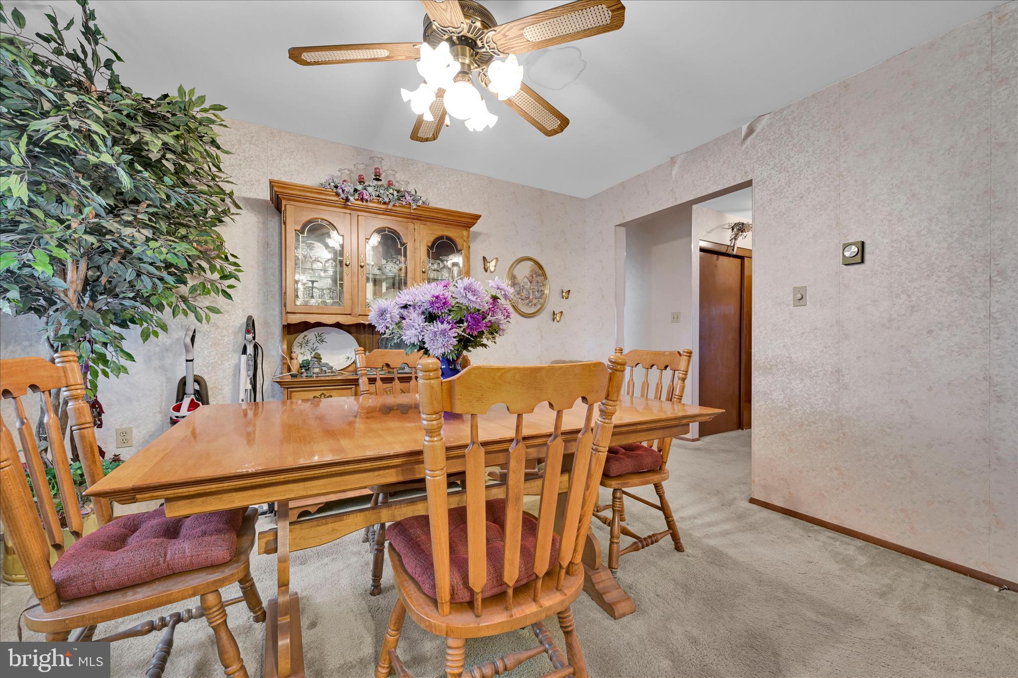 649 Stone Hill Road Shoemakersville, PA 19555 - Photo 17 of 43 a view of a dining room with furniture and chandelier