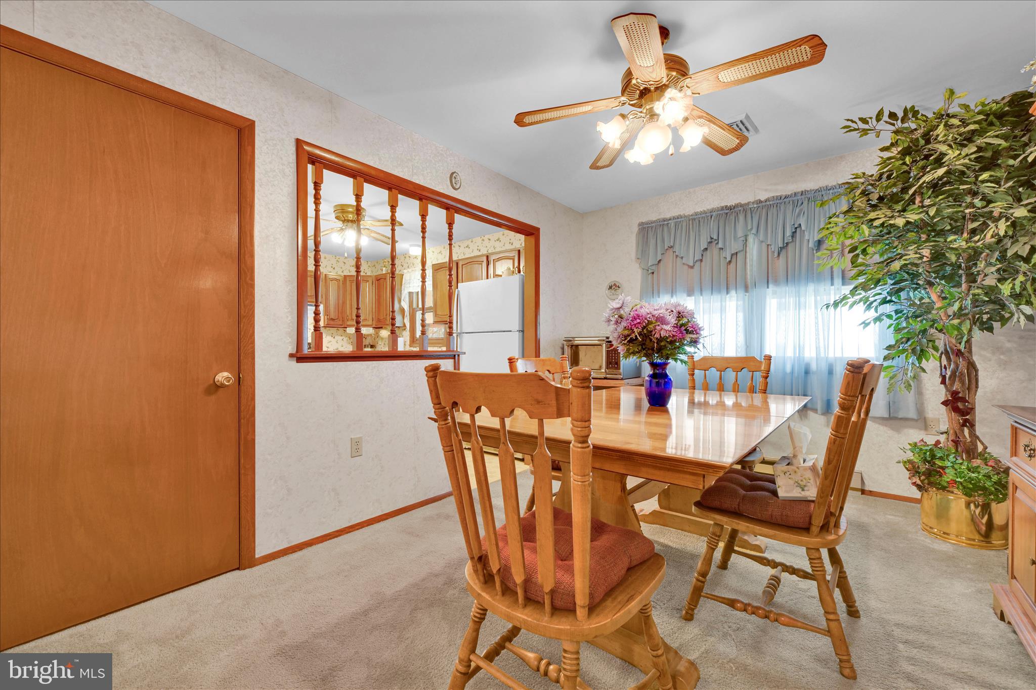 649 Stone Hill Road Shoemakersville, PA 19555 - Photo 18 of 43 a dining room with furniture potted plants and wooden floor