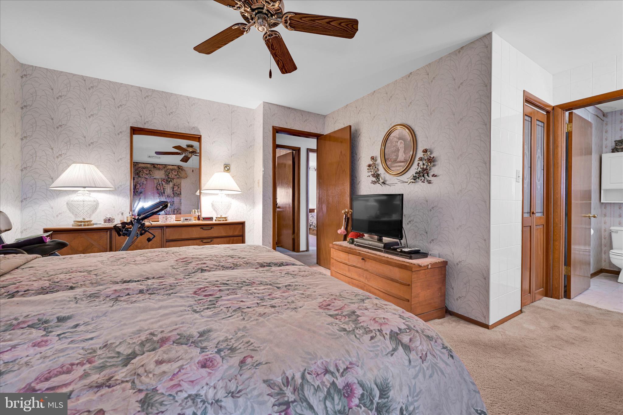 649 Stone Hill Road Shoemakersville, PA 19555 - Photo 24 of 43 a bedroom with a bed and a chandelier