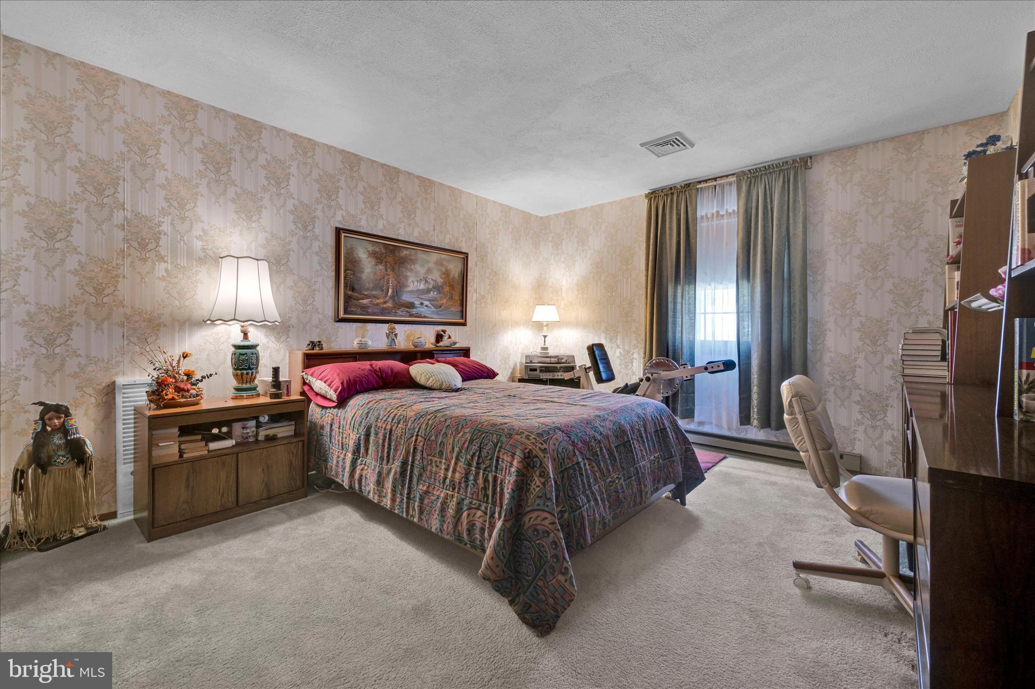 649 Stone Hill Road Shoemakersville, PA 19555 - Photo 26 of 43 a spacious bedroom with a bed and dresser