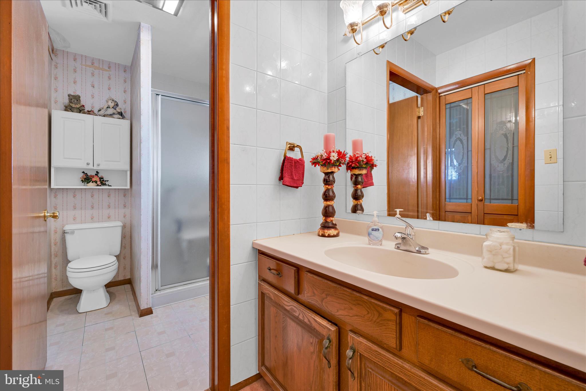 649 Stone Hill Road Shoemakersville, PA 19555 - Photo 28 of 43 a bathroom with a sink vanity mirror and toilet