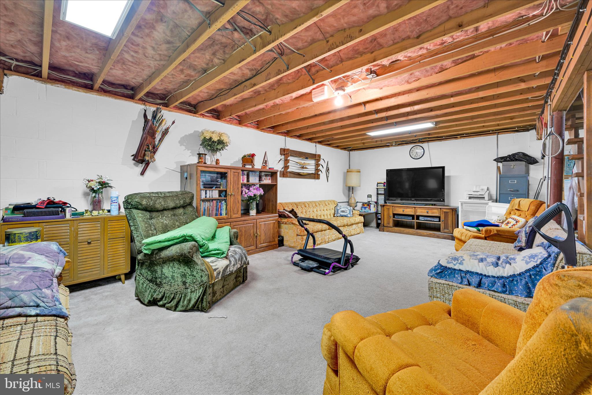 649 Stone Hill Road Shoemakersville, PA 19555 - Photo 29 of 43 a view of a livingroom with furniture and a flat screen tv