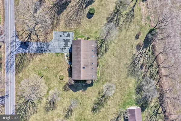 an aerial view of a houses with outdoor space