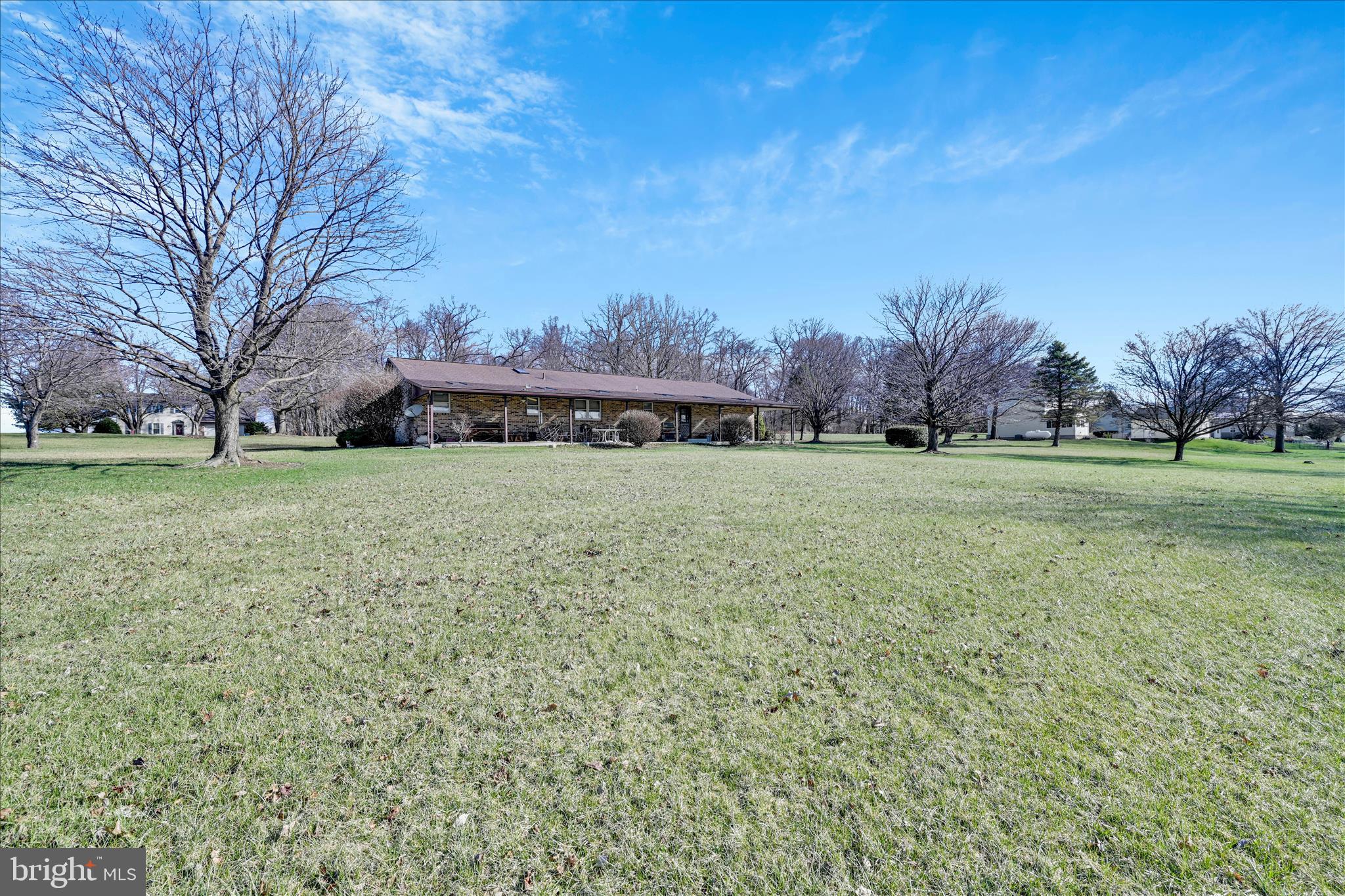 649 Stone Hill Road Shoemakersville, PA 19555 - Photo 38 of 43 a view of a field with trees in the background