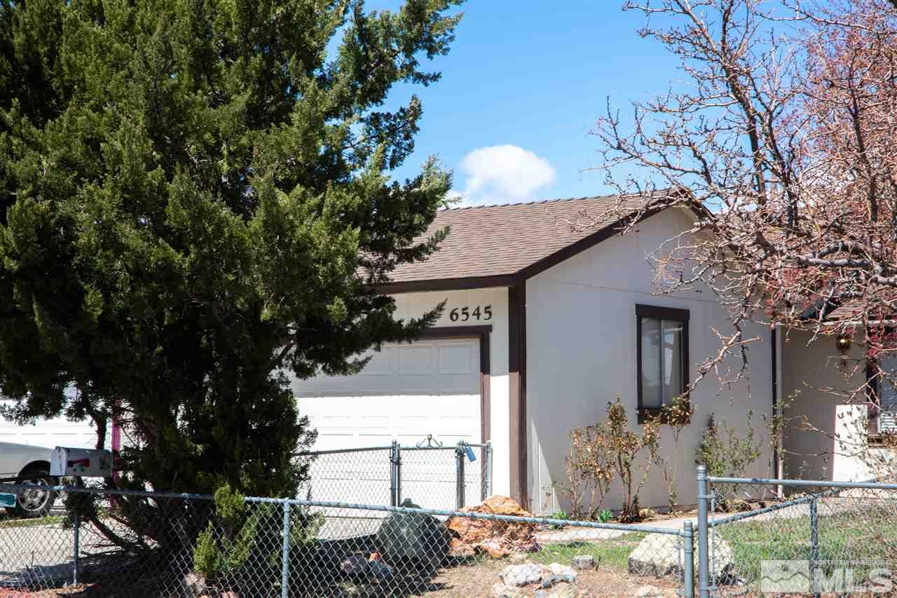 6545 Lotus Street Reno, NV 89506 - Photo 1 of 28 a front view of house with yard