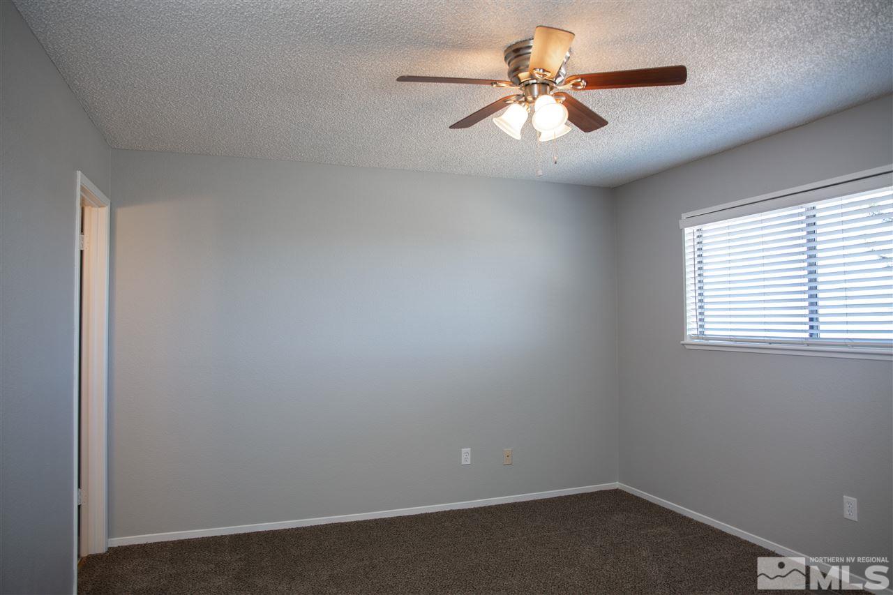 6545 Lotus Street Reno, NV 89506 - Photo 15 of 28 an empty room with windows and fan