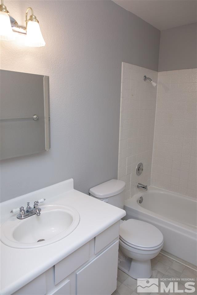 6545 Lotus Street Reno, NV 89506 - Photo 17 of 28 a bathroom with a sink toilet and shower