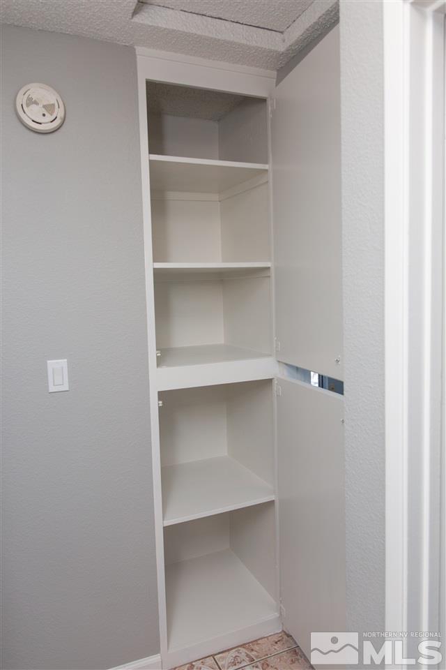 6545 Lotus Street Reno, NV 89506 - Photo 20 of 28 a view of walk in closet with empty racks