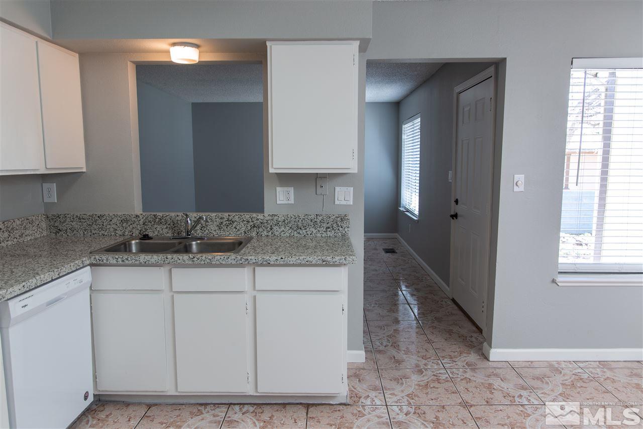 6545 Lotus Street Reno, NV 89506 - Photo 5 of 28 a bathroom with a sink and a mirror
