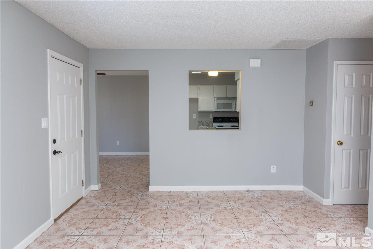 6545 Lotus Street Reno, NV 89506 - Photo 9 of 28 an empty room with mirror