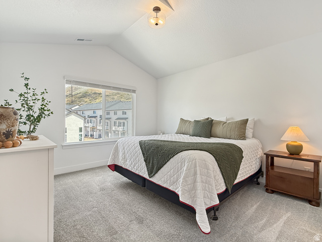641 Desert Willow Drive Mapleton, UT 84664 - Photo 18 of 41 Bedroom featuring light carpet and baseboards