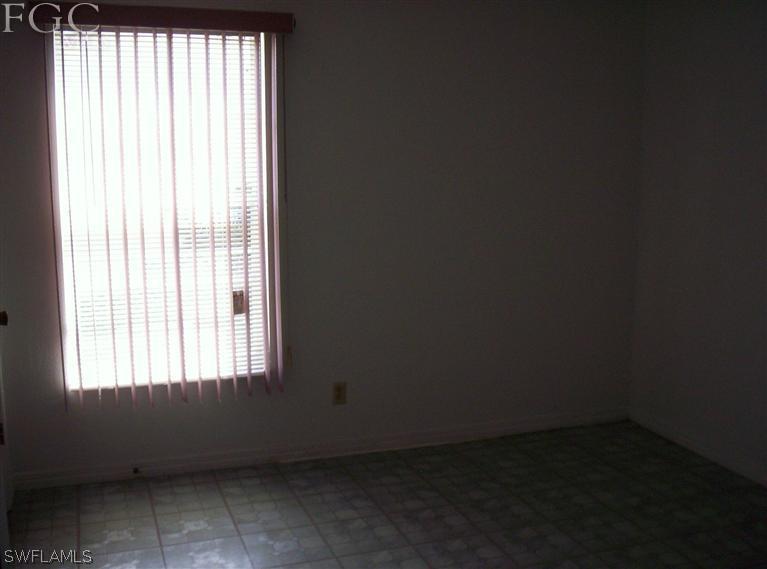 18567 Evergreen Road Fort Myers, FL 33967 - Photo 11 of 12 an empty room with a window